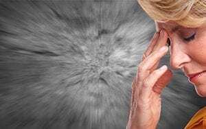 Woman with migraine due to anxiety Nuerofeedback can help