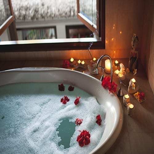 Large Filled Bath with Foam and Flowers. 