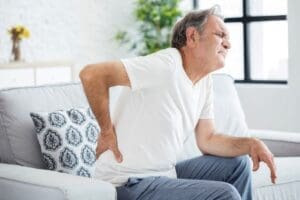 Man with back pain due to depression