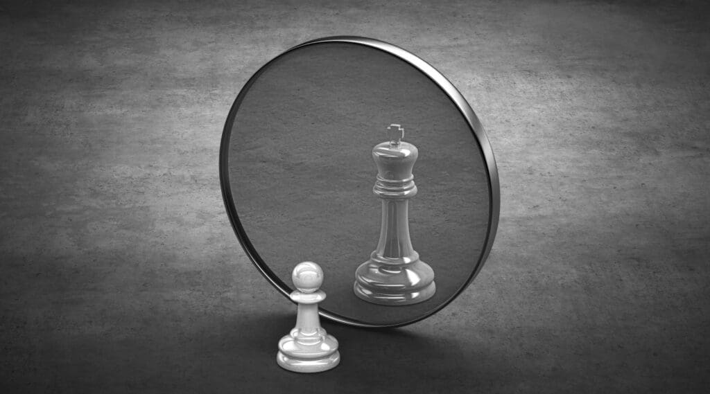 How we see ourselves in the mirror is self esteem. a chess piece sees itself as a king in this depiction