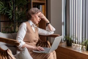 Image of older woman overwhelemed by stress