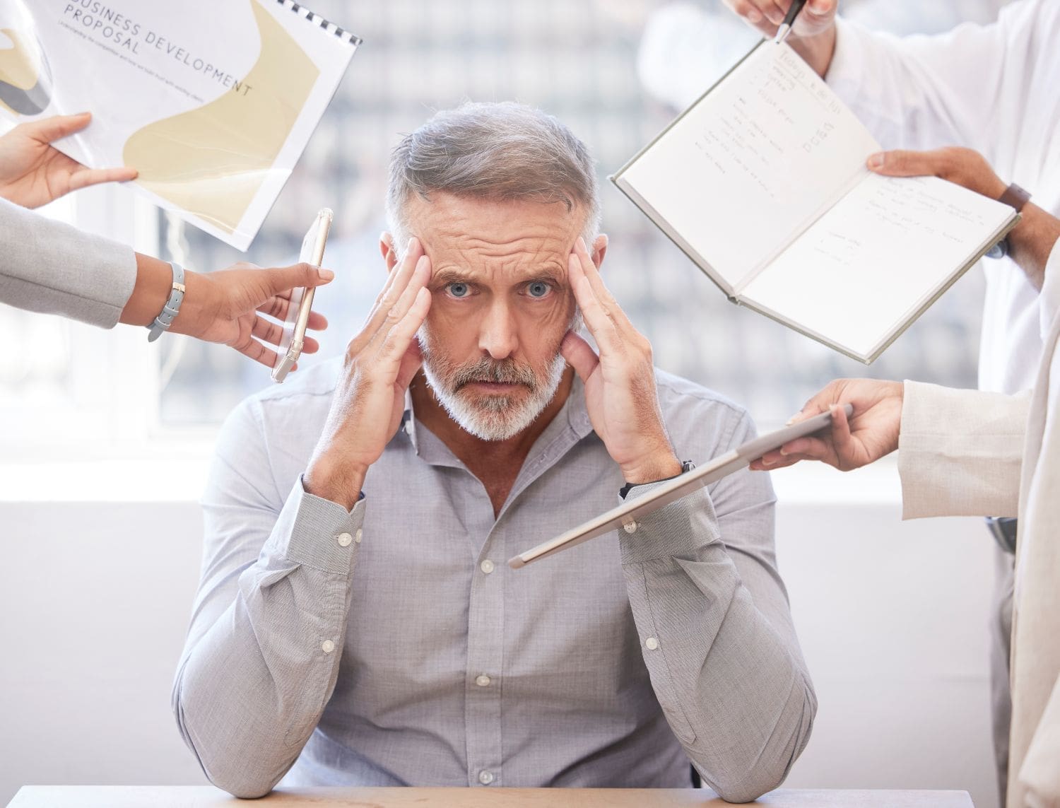 photo of male at work feeling overwhelmed due to ADHD