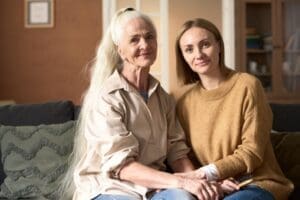 Photo of a caregiver managing stress and anxiety while caring for older adults. Dr. Ginny Estupinian helps caregivers with anxiety and stress.