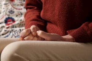 Close up of woman picking at cuticles, Skin picking disorder - classified as Obsessive-Compulsive and Related Disorders