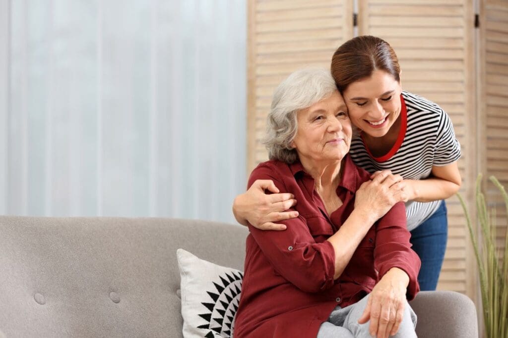 Photo of Caregiver with Older adult. Ginny Estupinian PhD geriatric psychologist provides support for caregivers of older adults