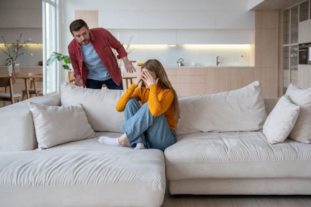 A photo of a couple arguing due to gaslighting behaviors. Dr. Ginny Estupinian helps individuals find the assistance they need to get out of the abuse