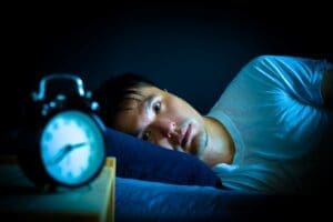 lying awake in the middle of the night due to insomnia